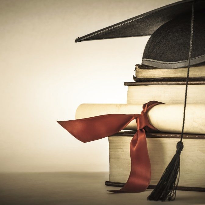 Graduation Scroll and Book Stack Credential Verifications
